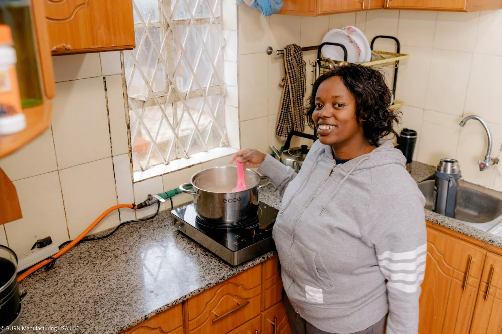 Cecilia%252520Njenga%252520using%252520her%252520ECOA%252520Induction%252520Cooker.jpg